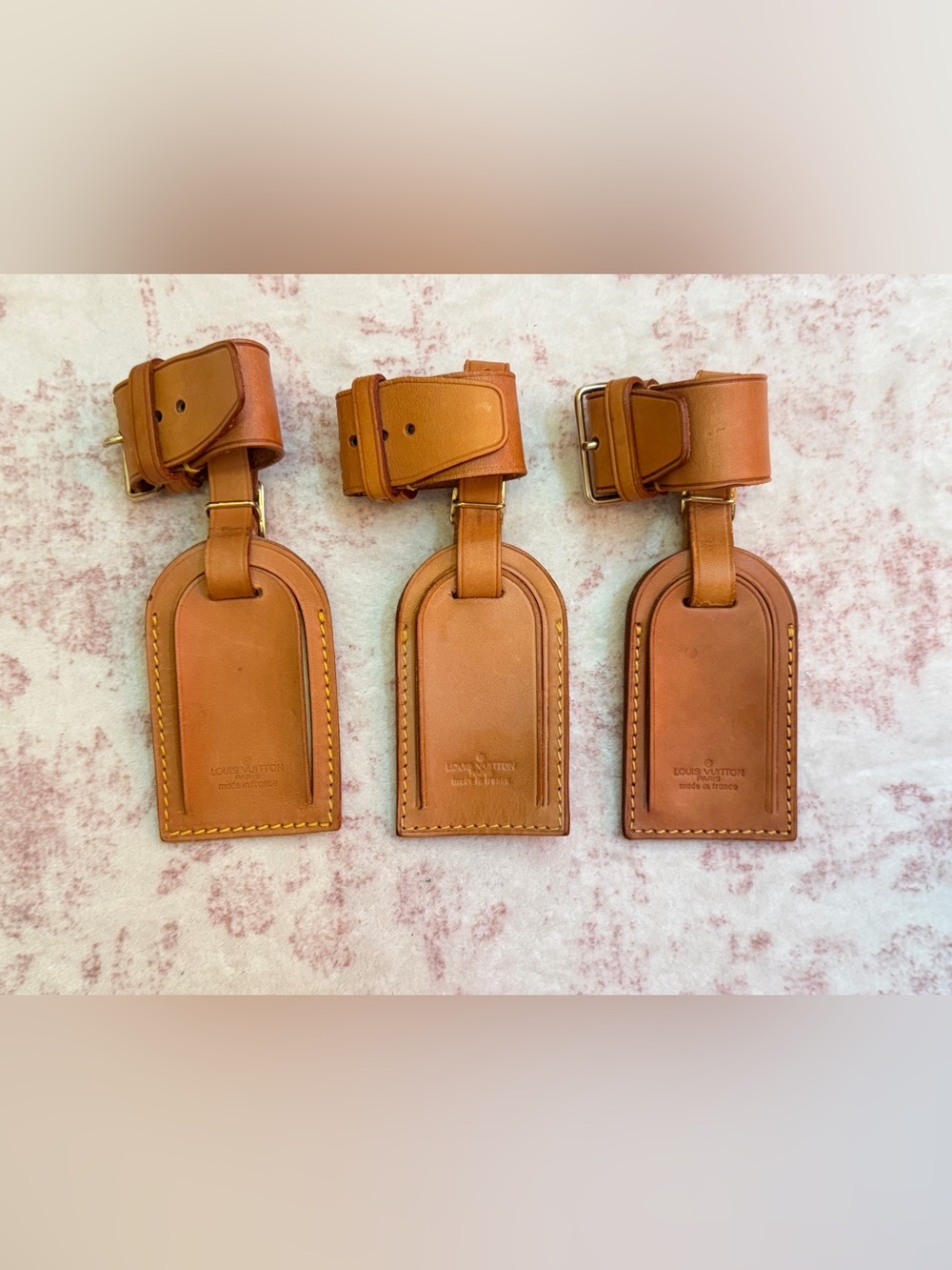 Set of 3 authentic Louis Vuitton Luggage Tags and Poignets